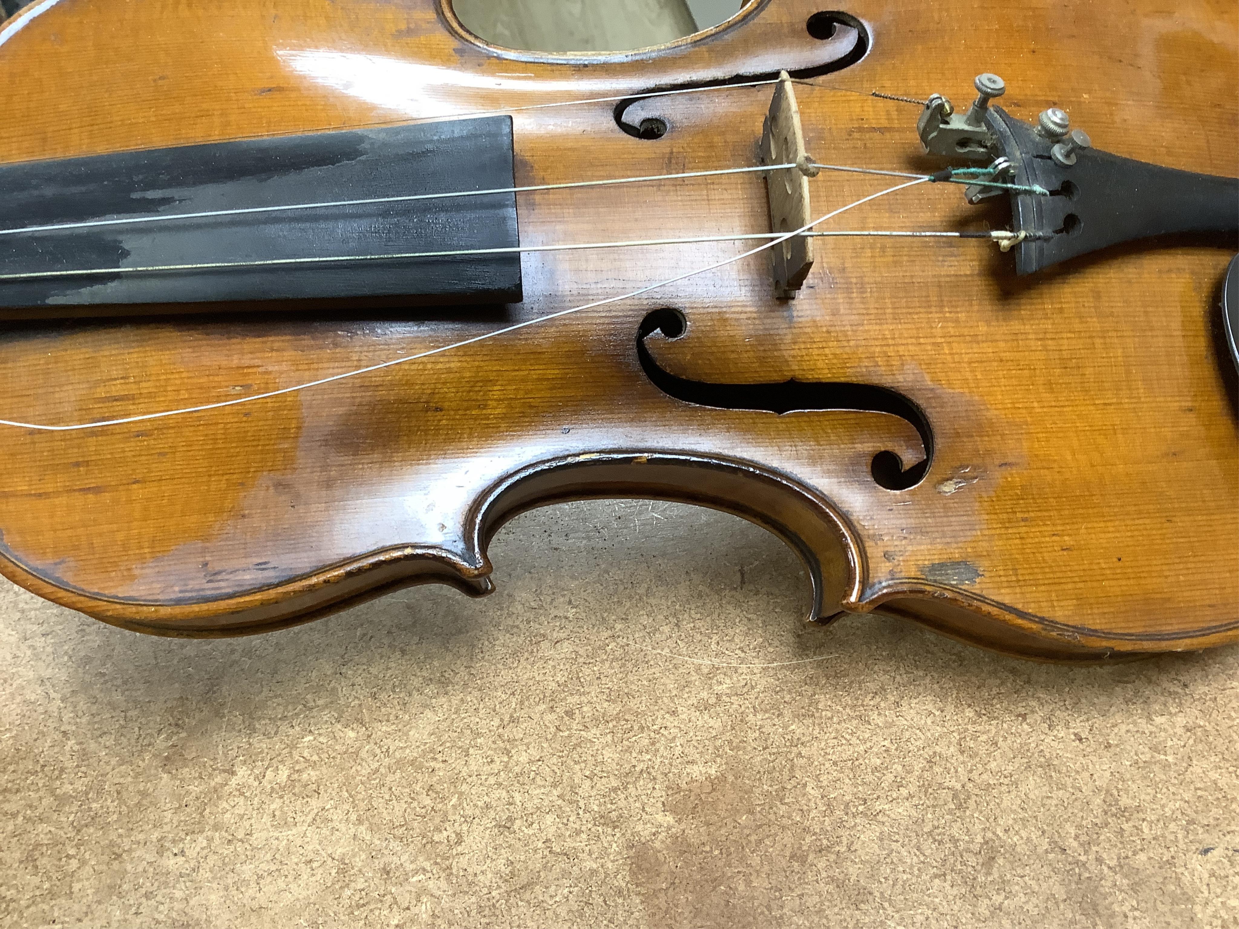 A late 19th century German violin in a Hill & Son oak case, with Hill canvas slip cover, together with an unbranded silver mounted bow, and another, ivory submission ref: 9HJU3B45 and ZC2E1GCP